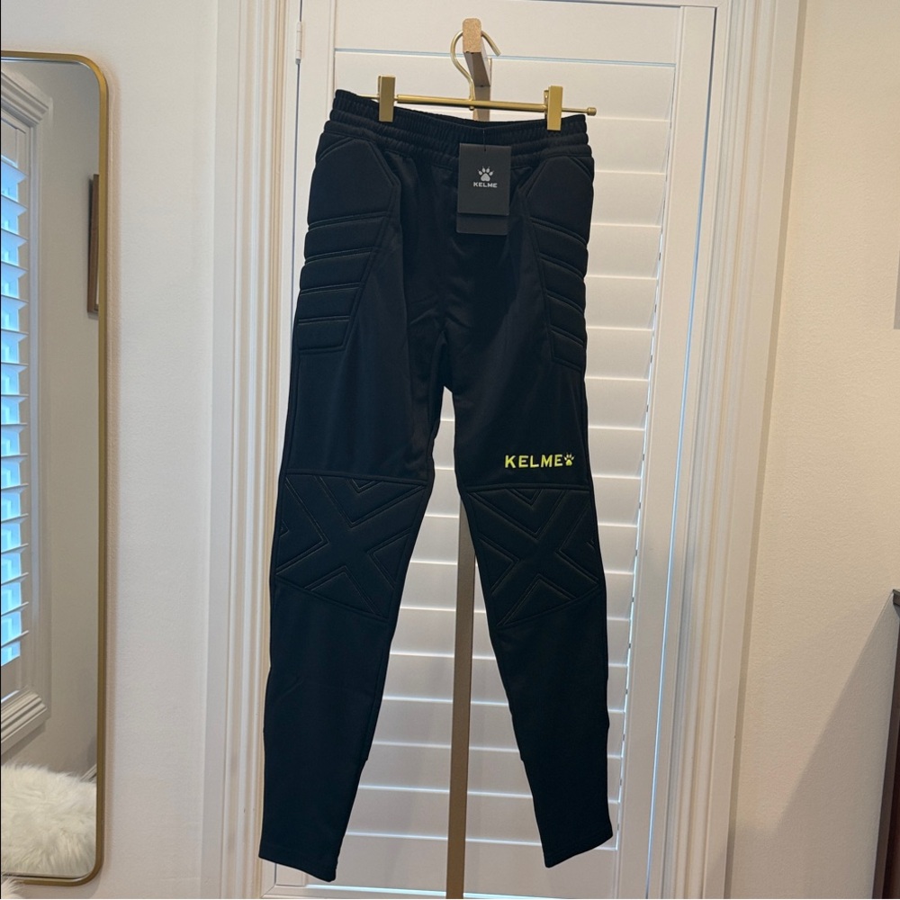 Kelme Black Goalkeeper Soccer pants with Yellow Accents Youth or Adult